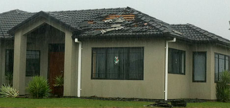 Some homes in Papamoa have had tiles blown off their roof. 