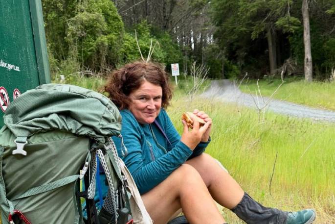 Hannah Dickie taking a break from walking through Waitangi Forest. Photo / Supplied