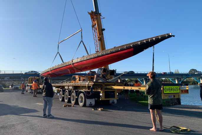 The Takitimu waka being placed on a truck on Monday, ready to be transported to the Waikato to join the Māori King’s funeral flotilla.